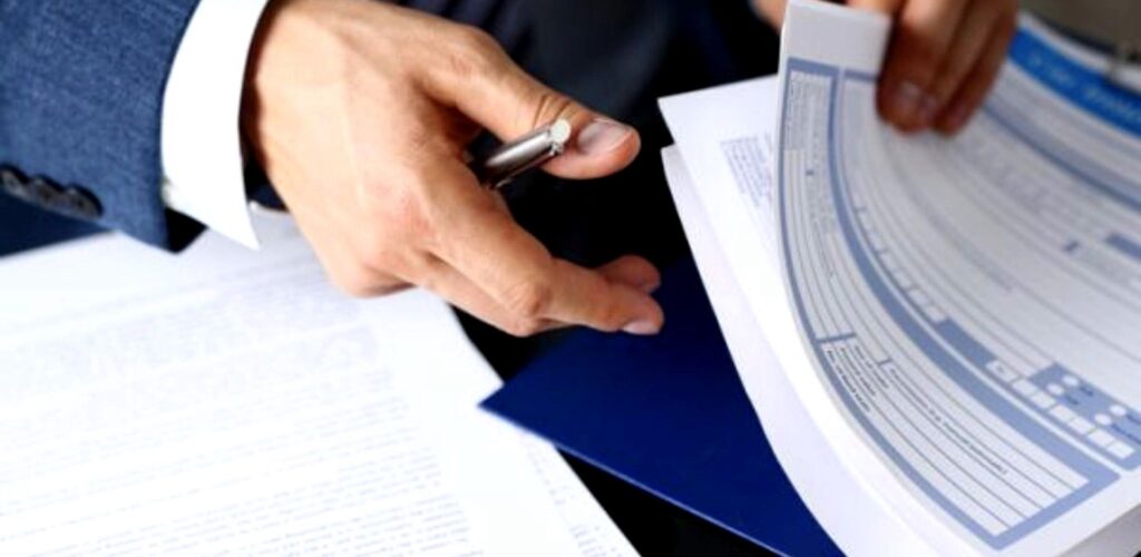 Clear view of reviewing financial documents during a professional consultation in the UK
