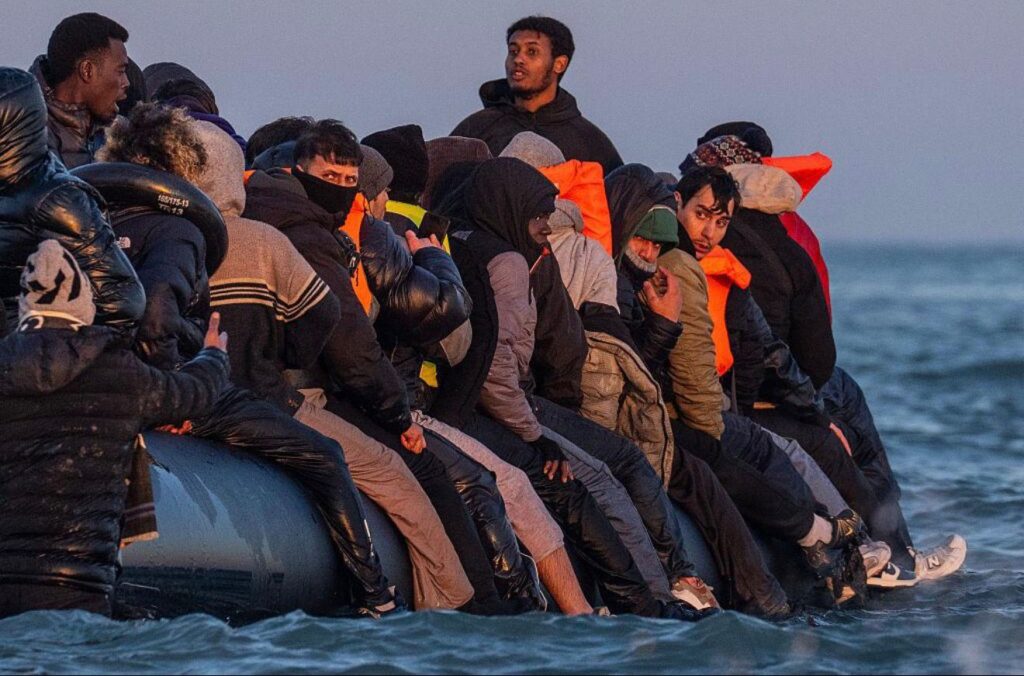 Migrants crossing the English Channel in a small boat attempting to reach the United Kingdom
